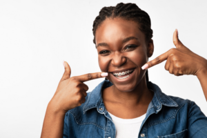 a patient with braces smiling